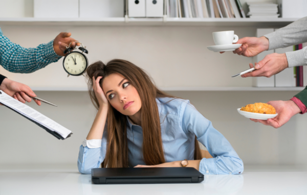 Overwhelmed woman at computer